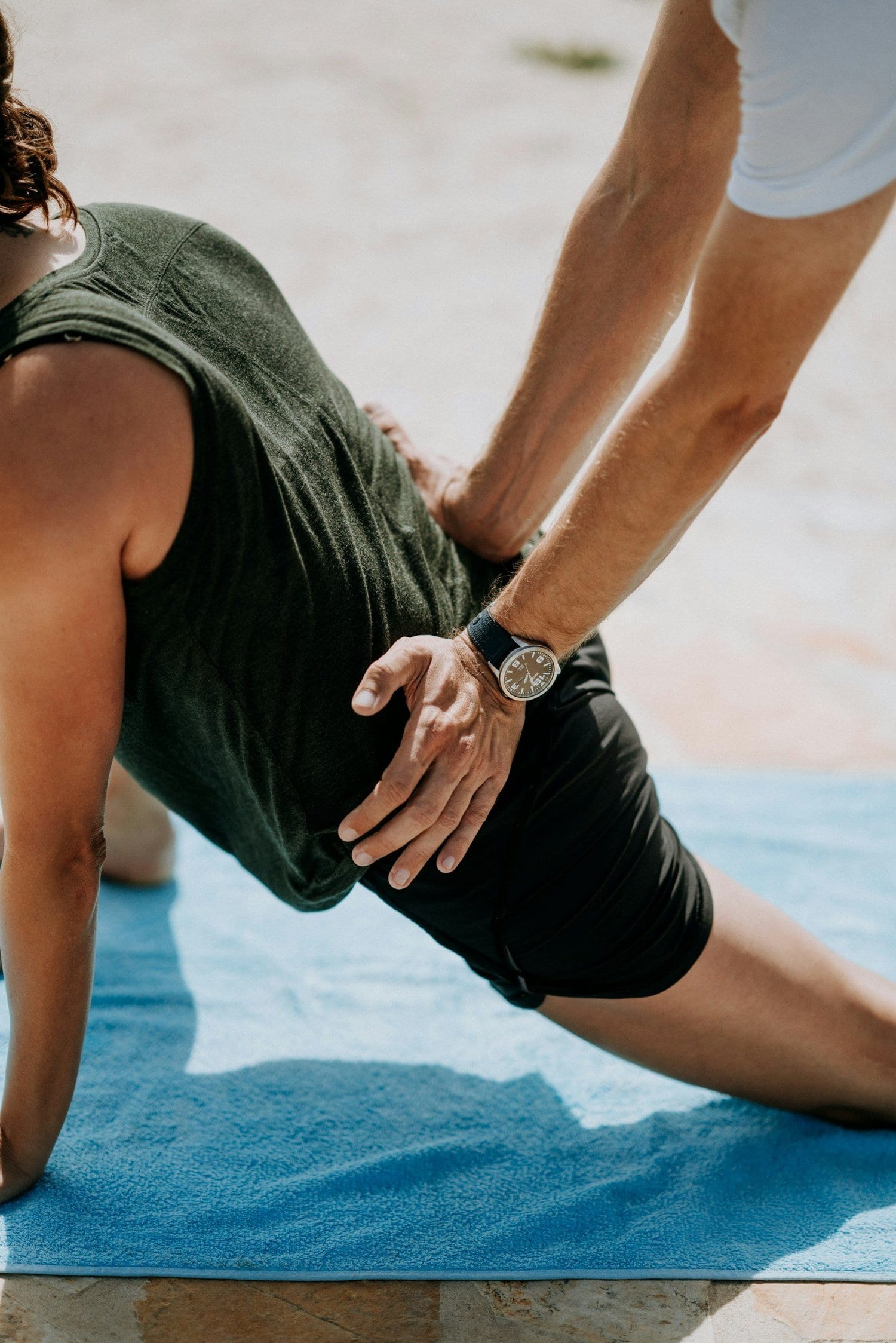 Physical Therapist providing hands-on, personalized guidance during an exercise session