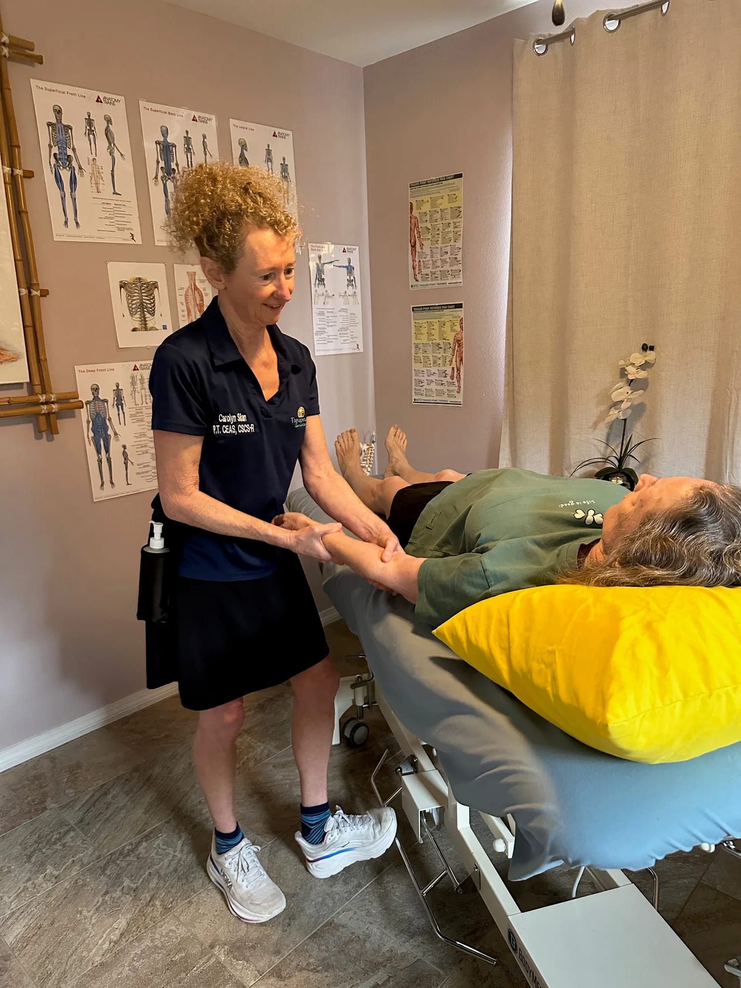 Therapist treating a patient's upper extremity