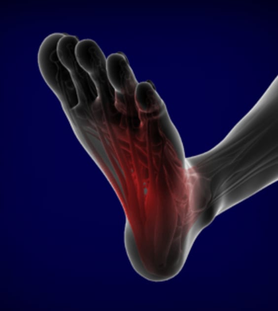 Person stretching and drinking water, simple ways to ease and prevent muscle cramps